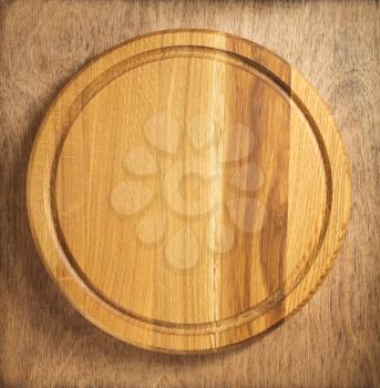 pizza cutting board at wooden table
