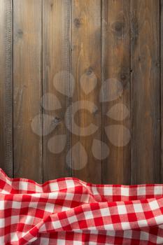 checkered napkin cloth on wooden background