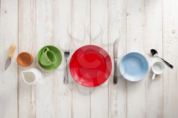 kitchenware and crockery at white wooden background