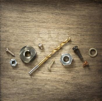 hardware tools and screws at wooden background