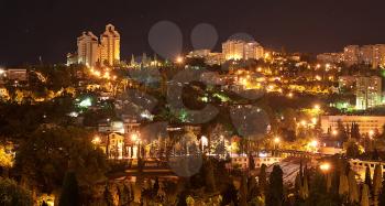 Panorama of Yalta. A night landscape of a city with burn lanterns.
