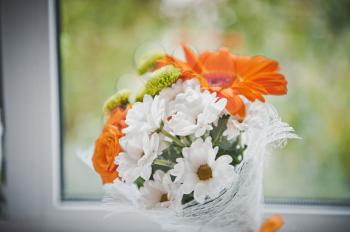 Bouquet from yellow and white flowers.