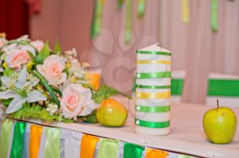 Candles on a table.
Example of celebratory registration of tables and home decoration.
