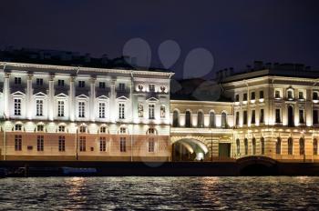Beautiful views of the night city from the motor ship going on the water areas of the Neva River and channels.