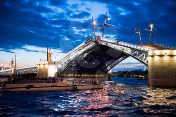 Night shooting in the city of St. Petersburg, process of cultivation of bridges, a view from the motor ship.