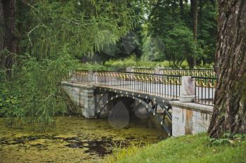 The bridge via the channel located in Catherine Park of Tsarskoye Selo nearby to the city of St. Petersburg.