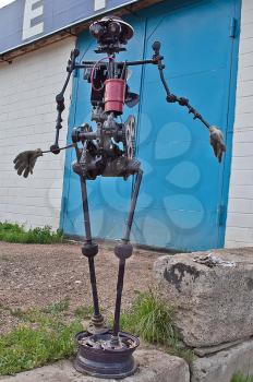 The robot from scrap metal. The robot about repair shop ma of old parts from cars.
