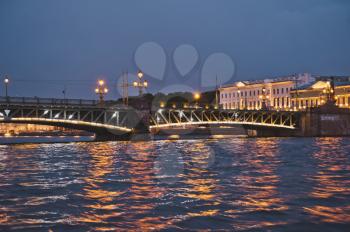 Night shooting from the motor ship during the White nights, a view of Troitsky Bridge in the city of St. Petersburg.
