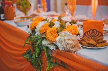 The halls decorated with an orange fabric.