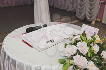 Table with documents for wedding.