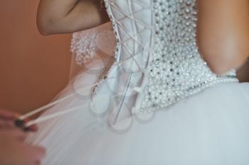 Process of setting of a wedding dress.