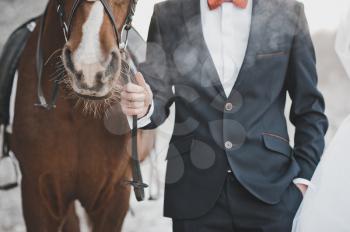 The groom and horse in a frost.
