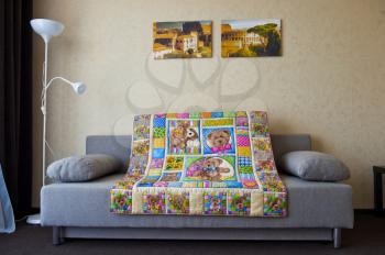 Small childrens blanket with drawings.