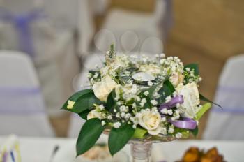 Beautiful bouquet on a table in a festive hall.