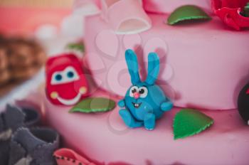 Childrens cake with figures.