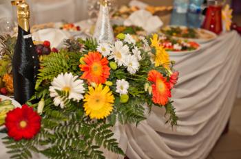 Table decorated with beautiful flowers.