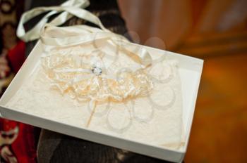 Garter on a foot of the bride.