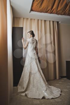 Wedding dress with large plume.