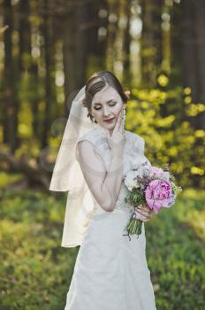 Portrait of a girl in a wedding dress and veil.