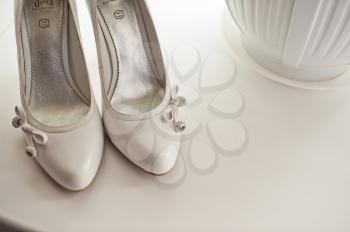 White beautiful shoes with ornaments.