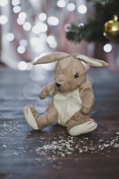 Toy hare under the tree.