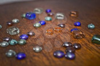 Stones from glass on a wooden table.