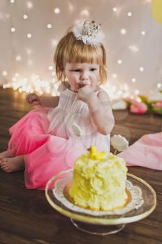 Little Princess eating her first cake.
