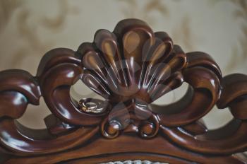 Carved wooden patterned backrest.