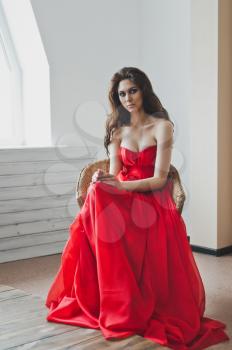 Beautiful girl with red long dress.
