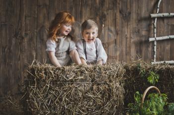 Children among the hay bales.