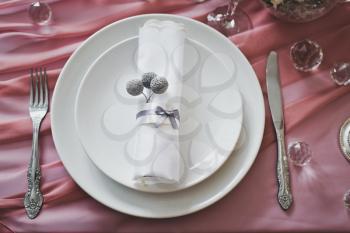 The arrangement of Cutlery on the table.