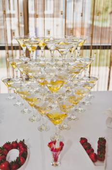 A three-level pyramid of champagne glasses.