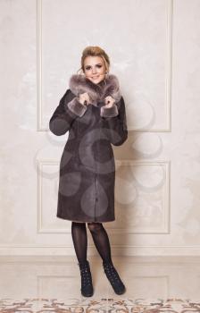 Studio photos for advertising of fur coats and sheepskin coats.
