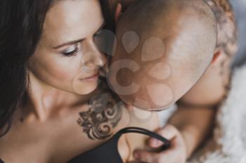 Portrait of young couple with tattoos with henna.