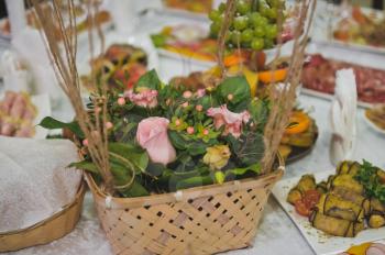 The decoration on the festive table with flowers.