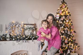 Family portrait on the background of Christmas decorations photo Studio.