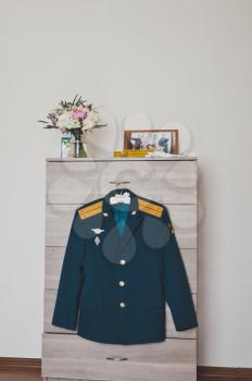 Military uniform on a hanger.