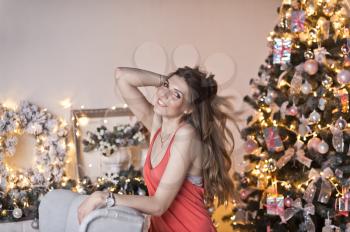 The girl with her long hair in Christmas decorations.
