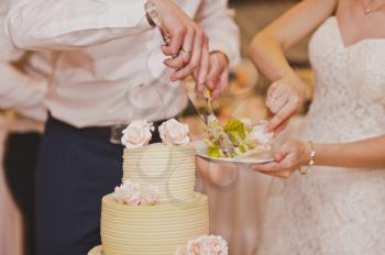 The process of cutting the cake to share for guests.