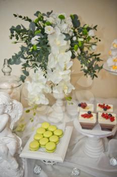 Table with sweet treats for guests.