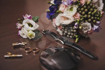 Bouquet, boutonniere and wedding rings.