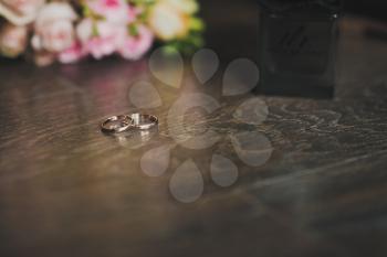 Background with wedding rings on the table.