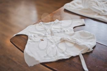 White baby vest for babies.