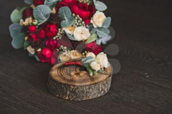 Wedding ring and wedding bouquet with boutonniere.