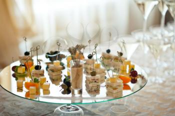 Champagne appetizers on skewers.