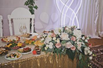 Festive table with dishes and salads.