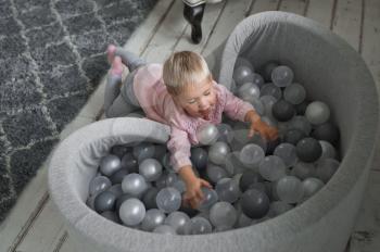 Large pool with balls in the house for children.