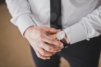 Business man with a watch.