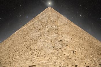 Pyramid at night under the stars. shining star