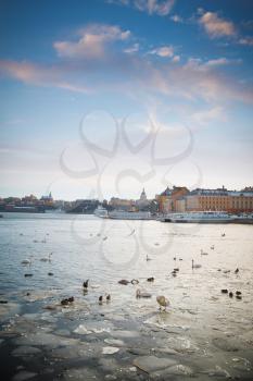 A view of Stockholm's gamla stan region from across the frozen river in winter time.